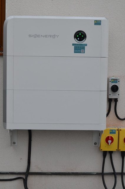 SigenStor hybrid inverter and battery installed on exterior wall
