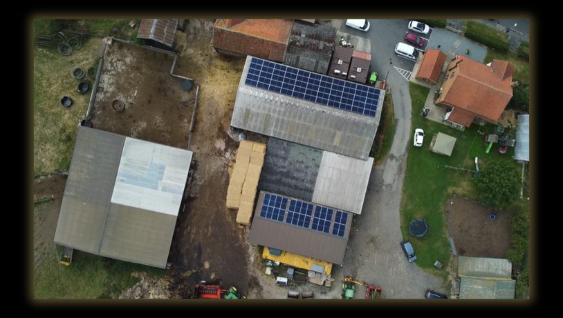 Second aerial view of the farm buildings and solar installation
