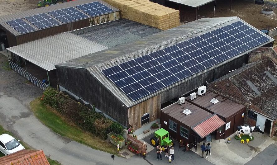 Aerial view of Bellfield Farm with solar panels across two roofs